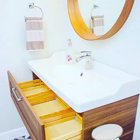 White Sink And Wooden Vanity And Mirror Renovation